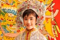 Adorable face of a chinese opera actress in beautiful traditional costume, smiling at camera, colorful of traditional chinese